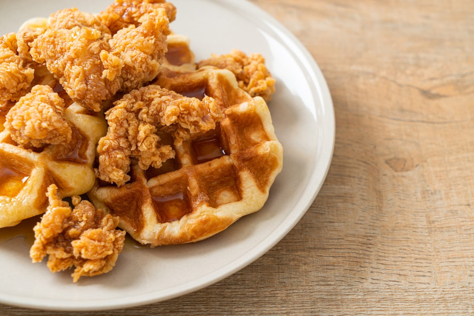 homemade fried chicken waffle with honey or maple syrup