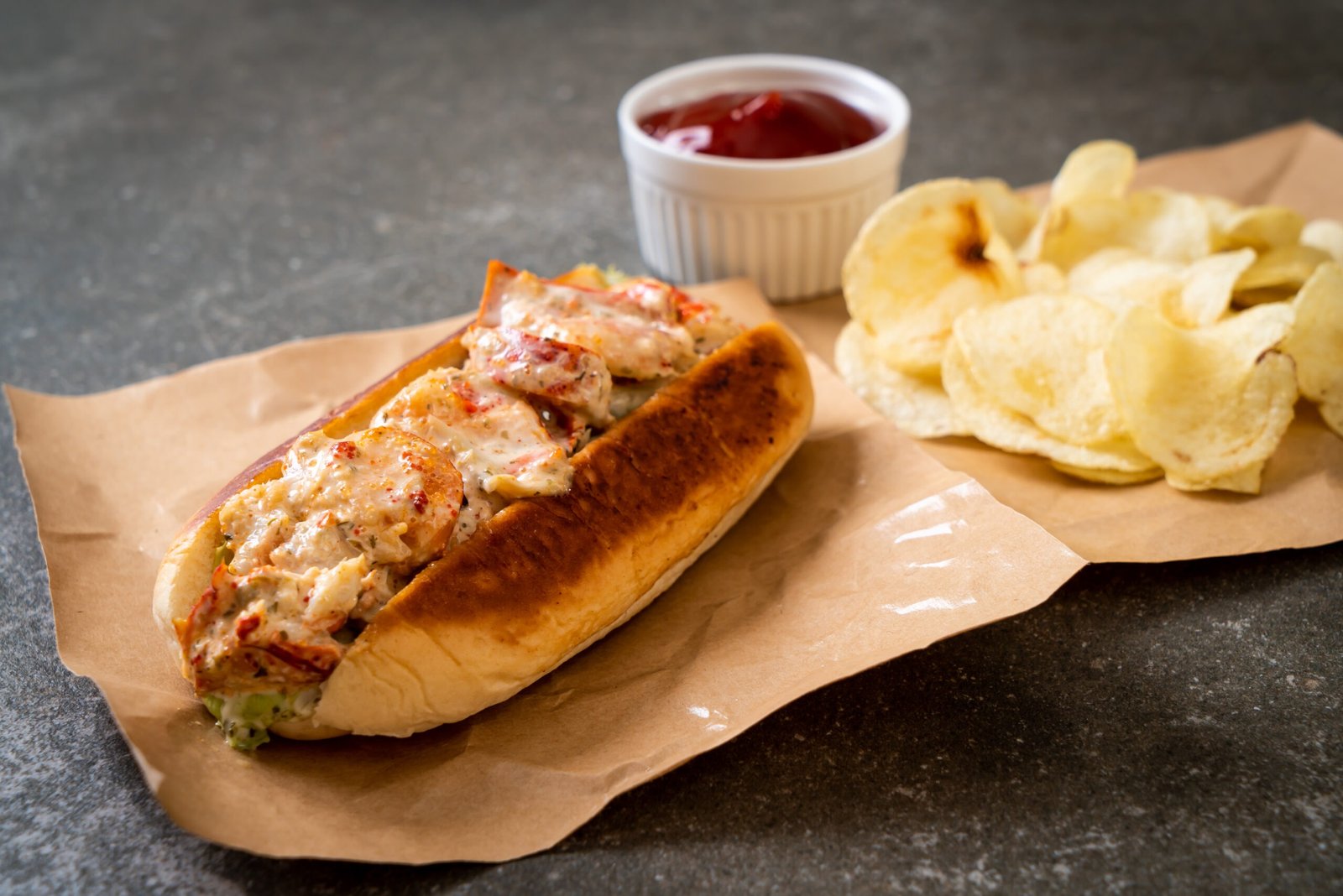 homemade lobster roll with potato chips