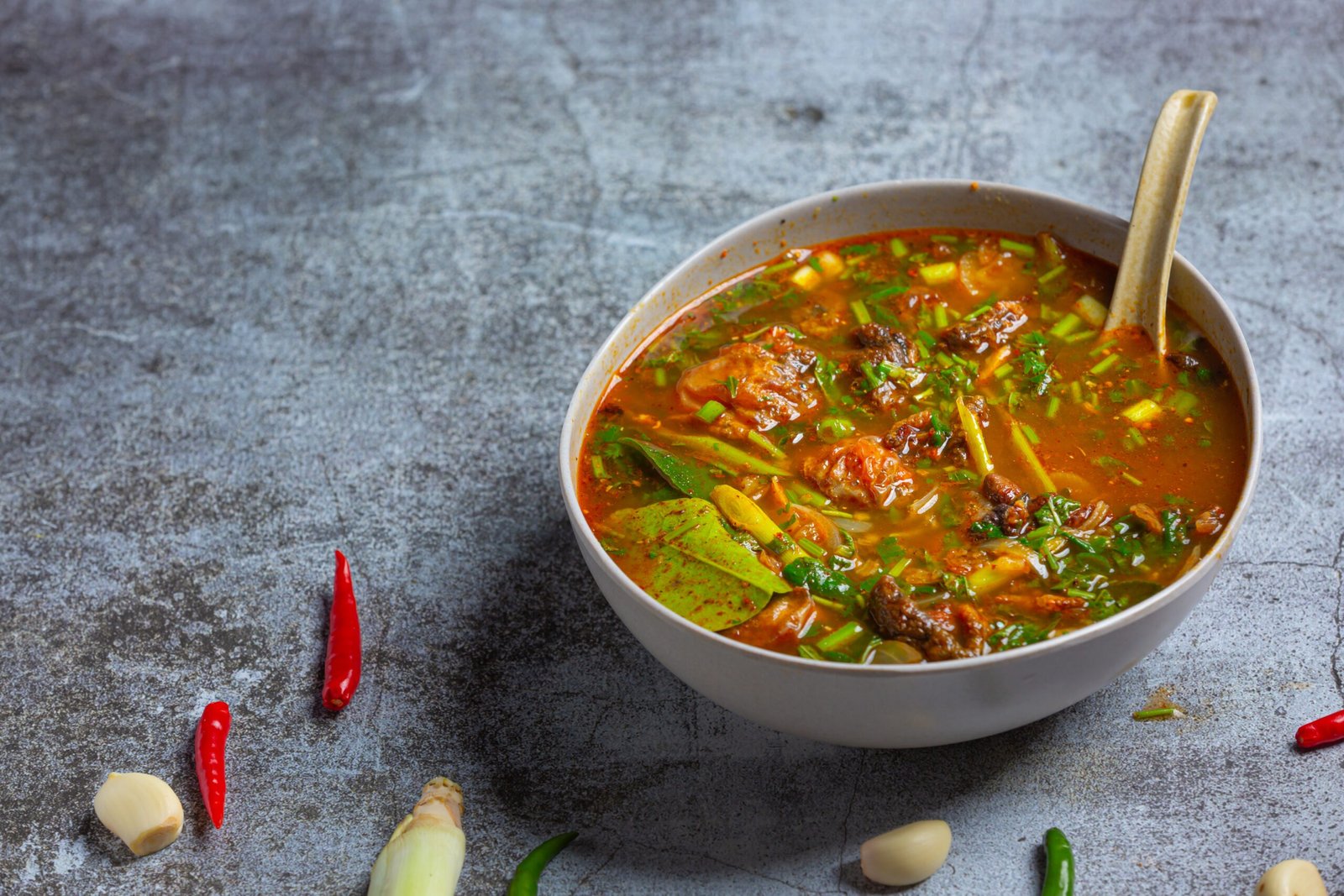 Pork Curry, Thai cuisine on wooden background.