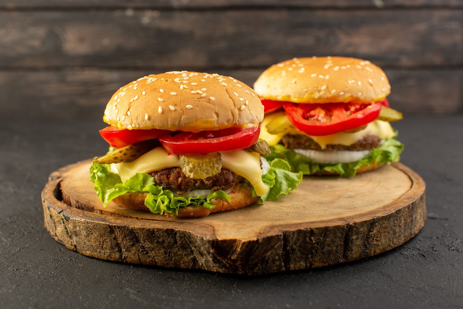 FAVOURITE FOODS IMG 48 Cheeseburger front-view-chicken-burgers-with-cheese-green-salad-wooden-desk-sandwich-fast-food-meal-food