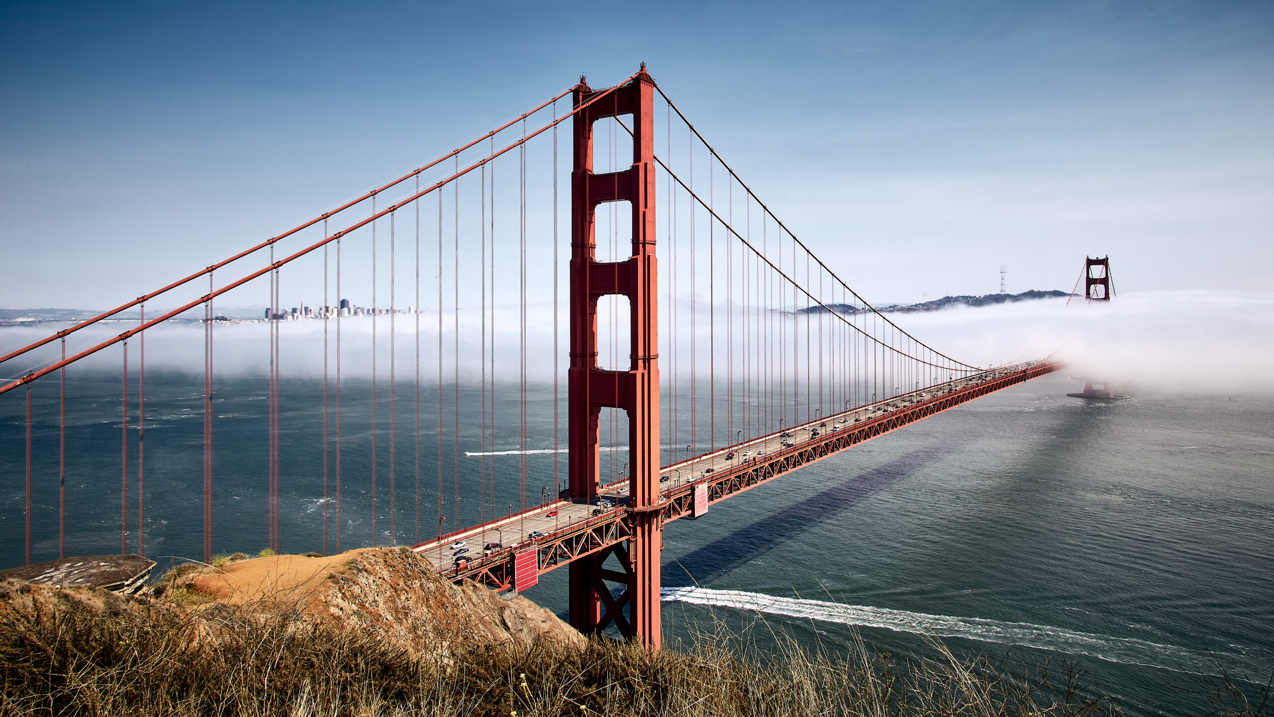 The Golden Gate Bridge against a misty blue sky in San Francisco, California, USA